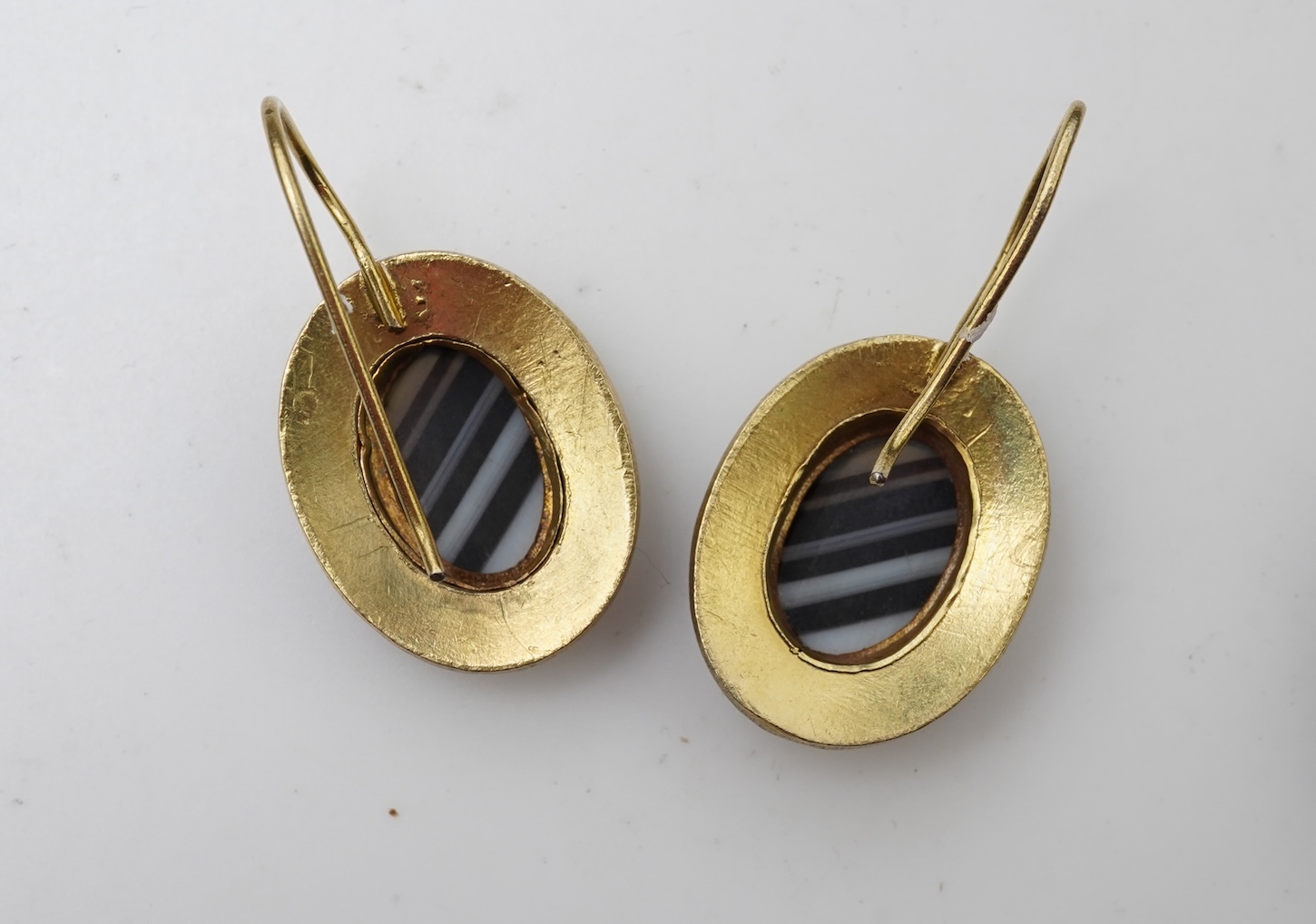 An enamel and onyx demi-parure, late 19th century